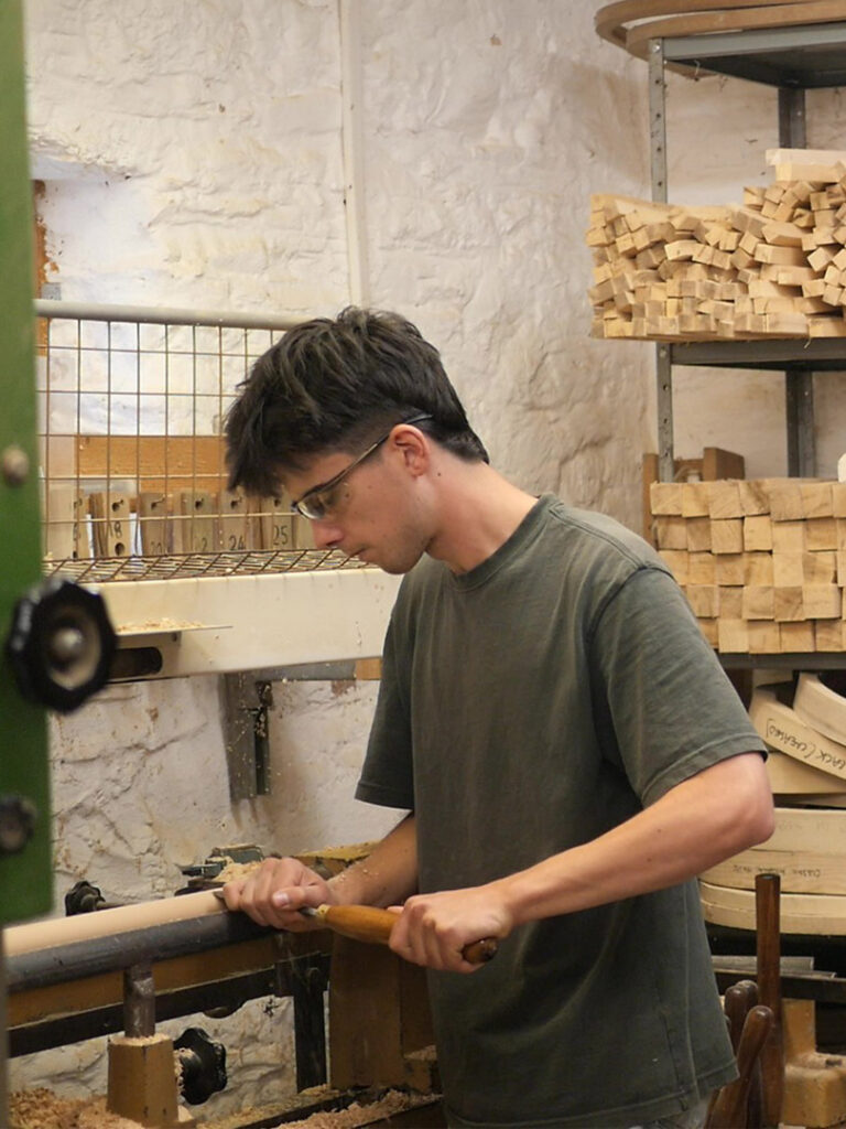 Traditional Windsor chairmaker working with local timber in a chairmaking workshop.