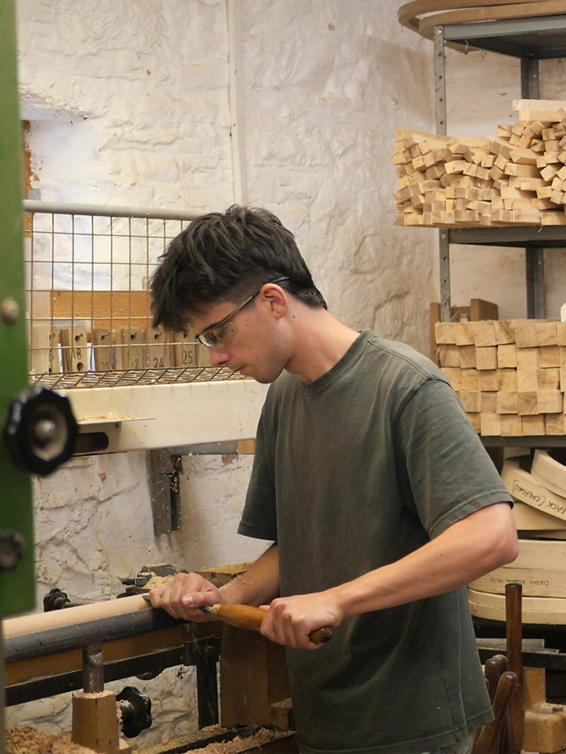 Traditional Windsor chairmaker working with local timber in a chairmaking workshop.