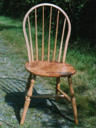 Handmade back hoop Windsor chair made from local timber, shown outdoors.