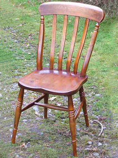 Handmade lath back Windsor chair made from local timber, shown outdoors.