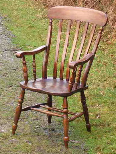 Handmade lath back Windsor chair made from local timber, shown outdoors.