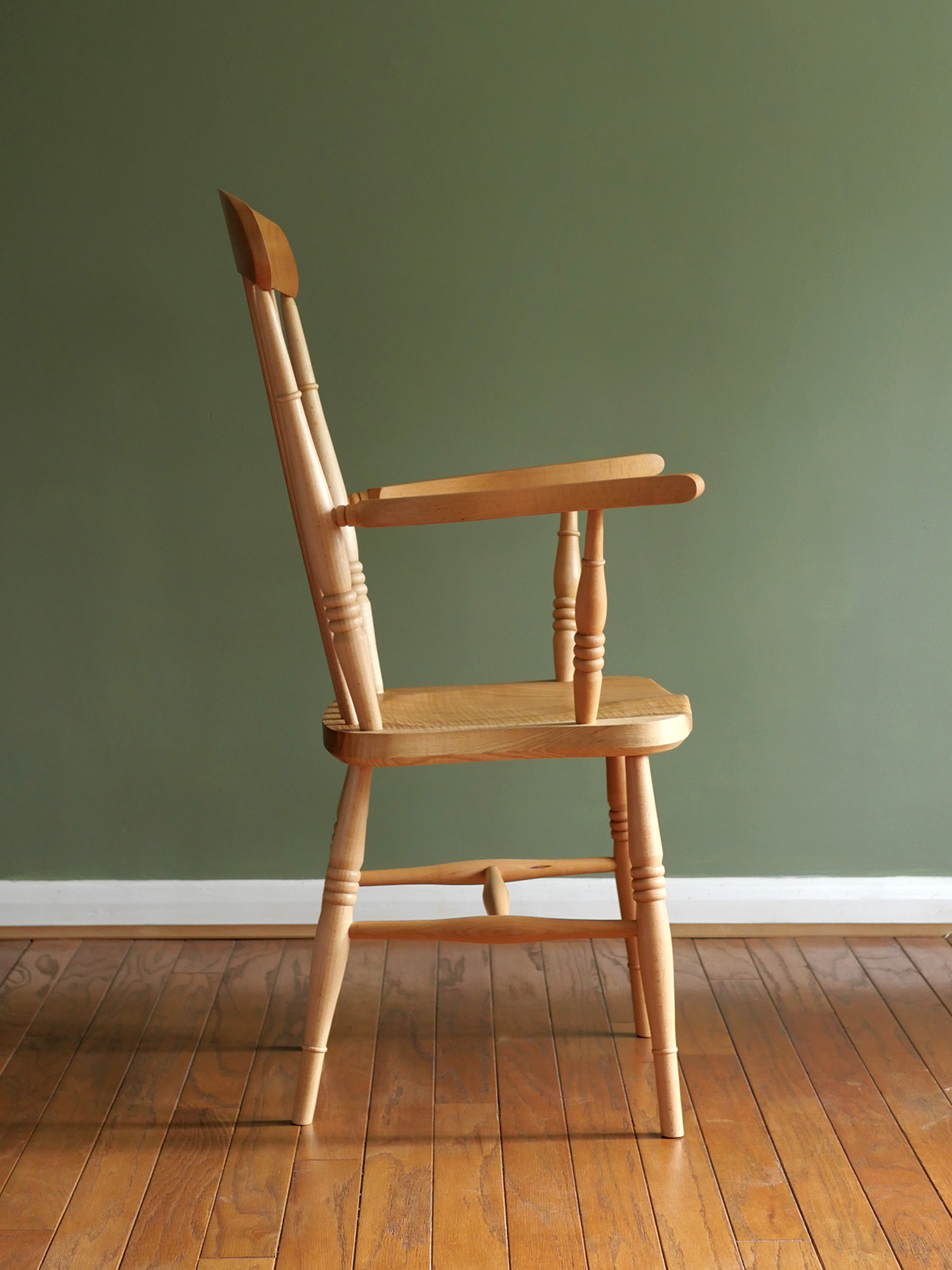 Handmade English comb back Windsor chair in beech with ash seat.