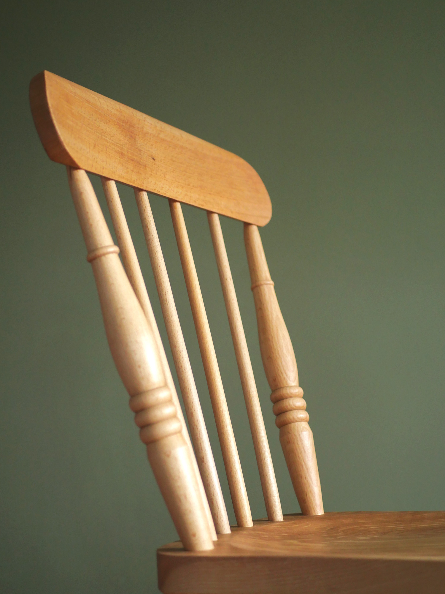 Handmade English comb back Windsor dining chair in beech with ash seat.